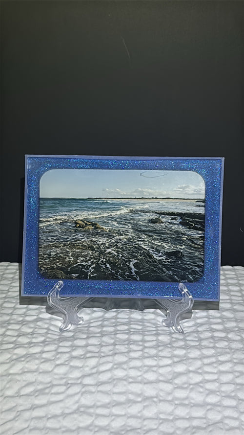 Custom glittery blue epoxy framed photo of a beach in Australia.