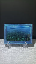 Custom glittery blue epoxy framed photo of the Mediterranean Sea.
