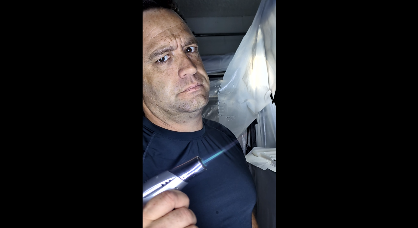 Navy Veteran using a torch while creating epoxy art in Florida, USA